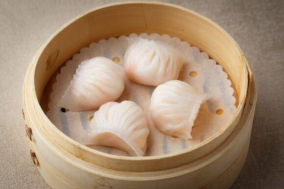Steamed shrimp dumplings in bamboo steamer